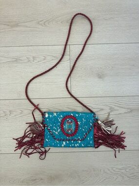 Turquoise Fringe Crossbody with Red Accents